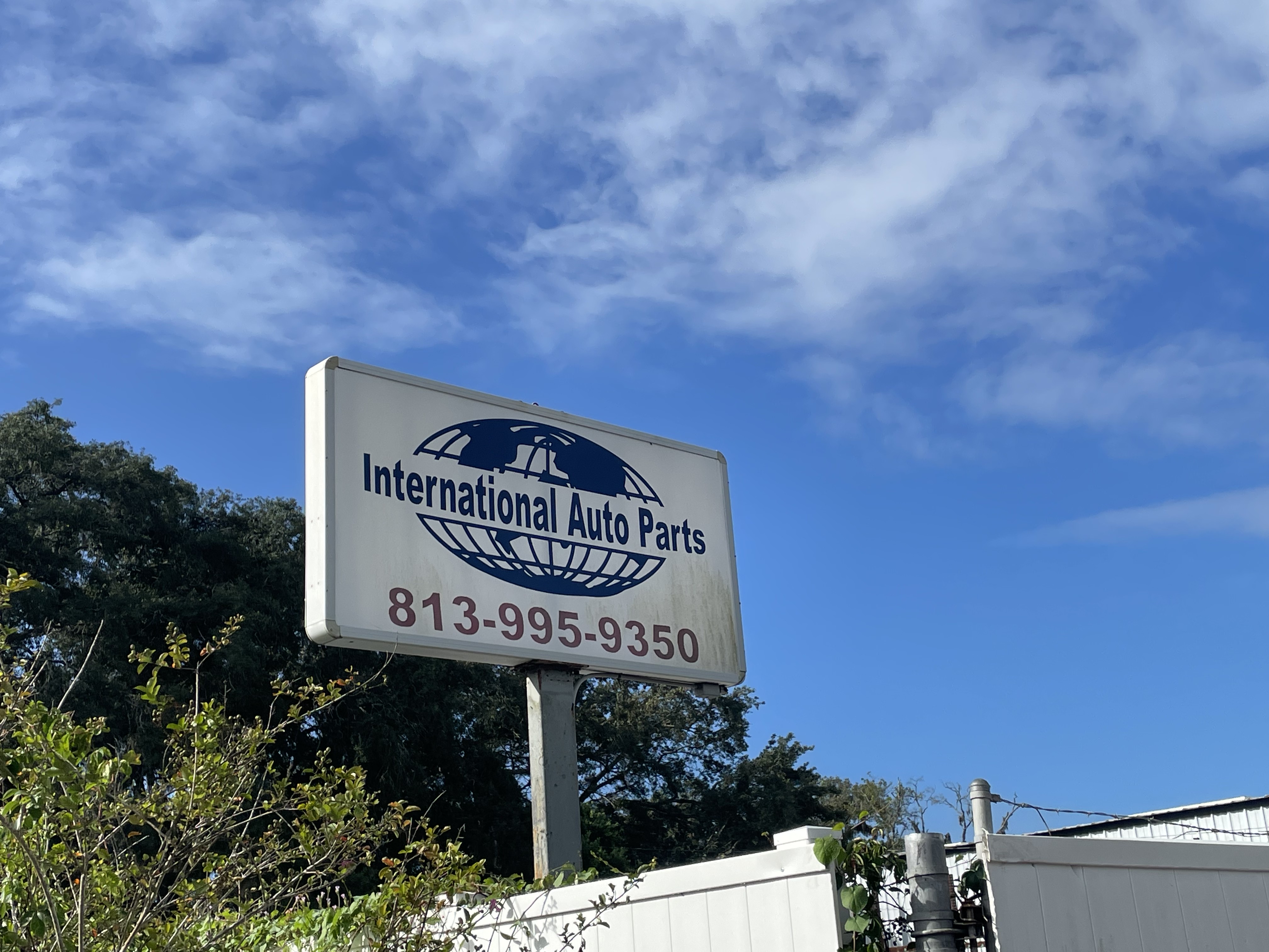 International Auto Parts yard sign