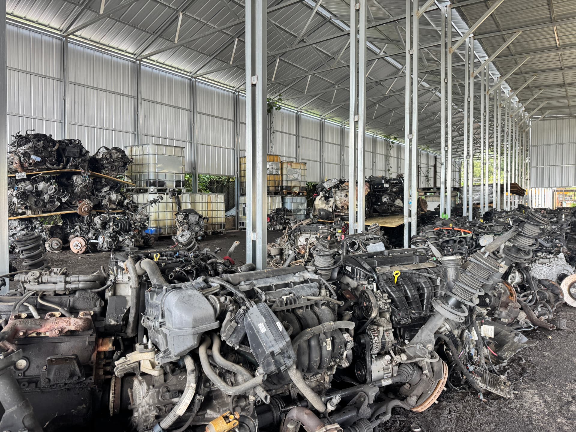 Warehouse aisle filled with engines and parts