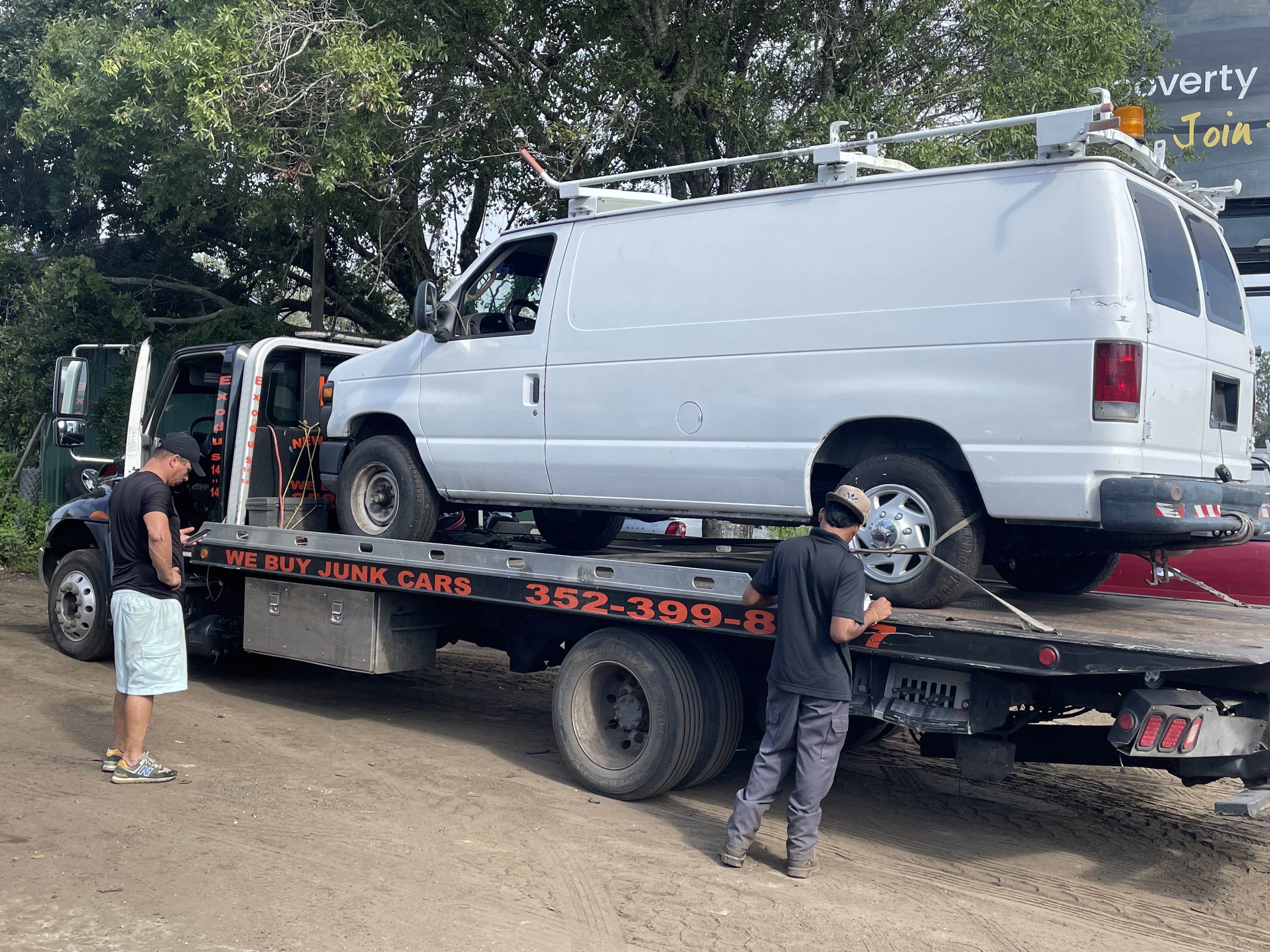 Tow truck hauling a van